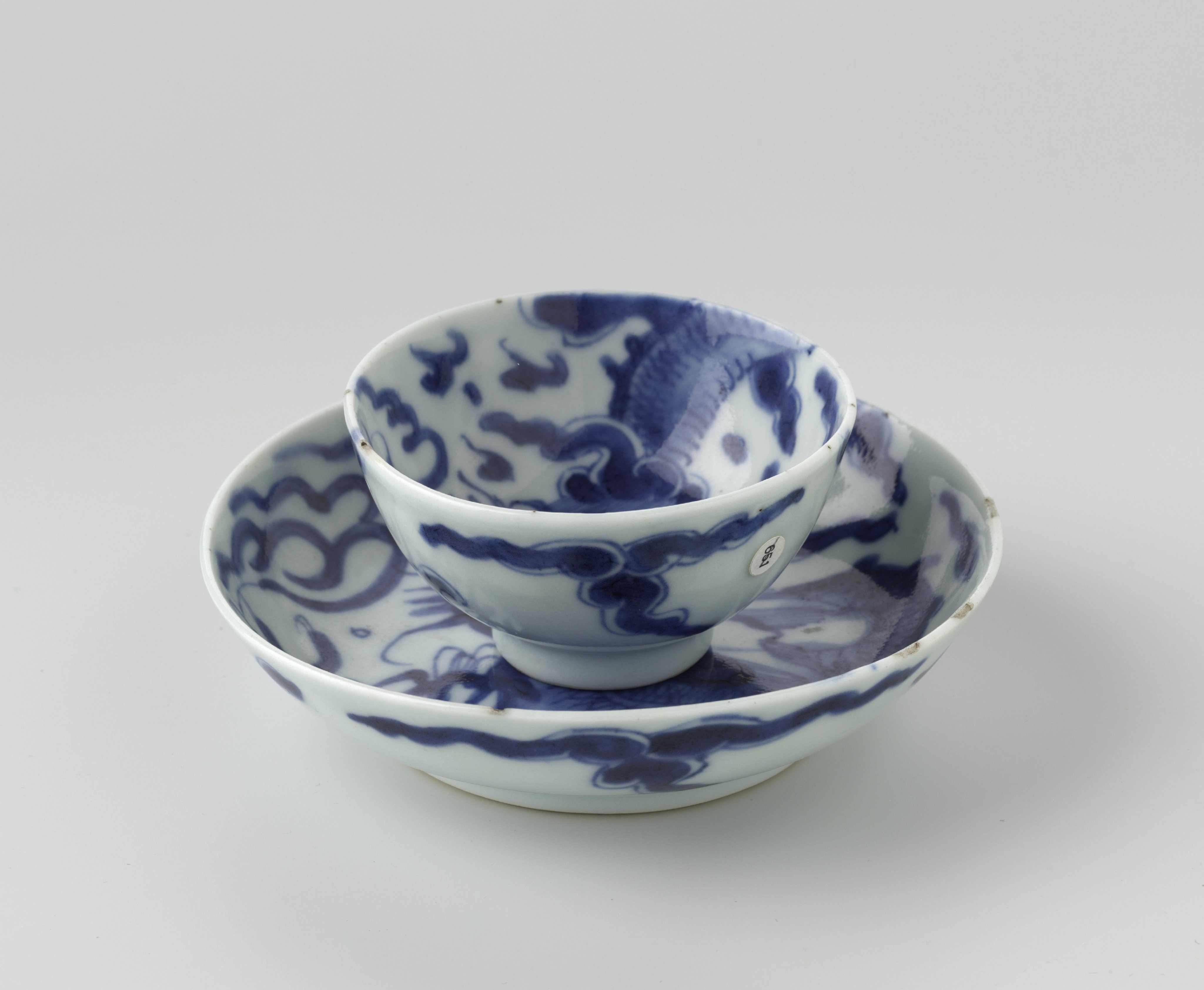 Cup and saucer with a pearl chasing dragon