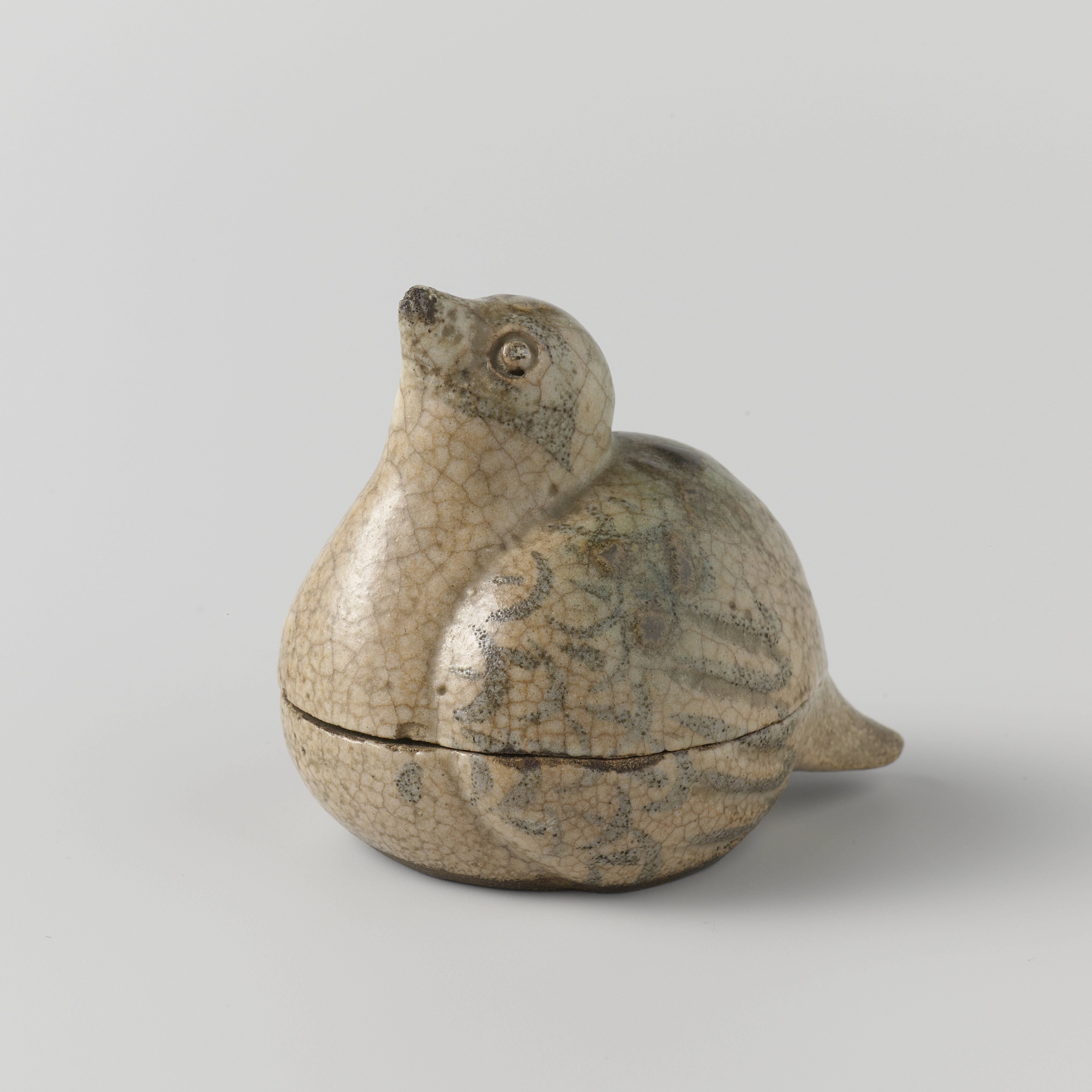 Incese box in the shape of a bird