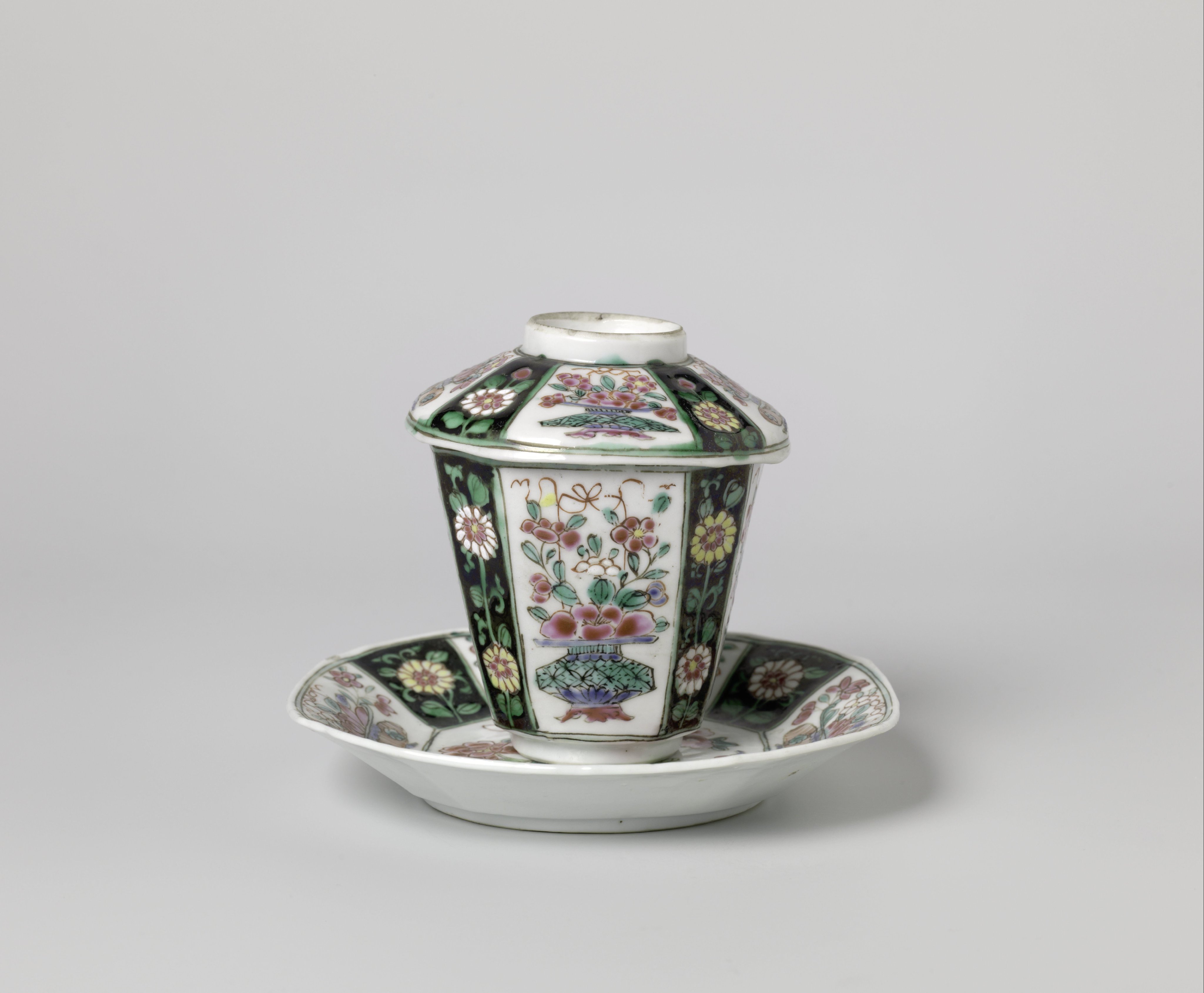 Covered cup and saucer with flower baskets and floral scolls