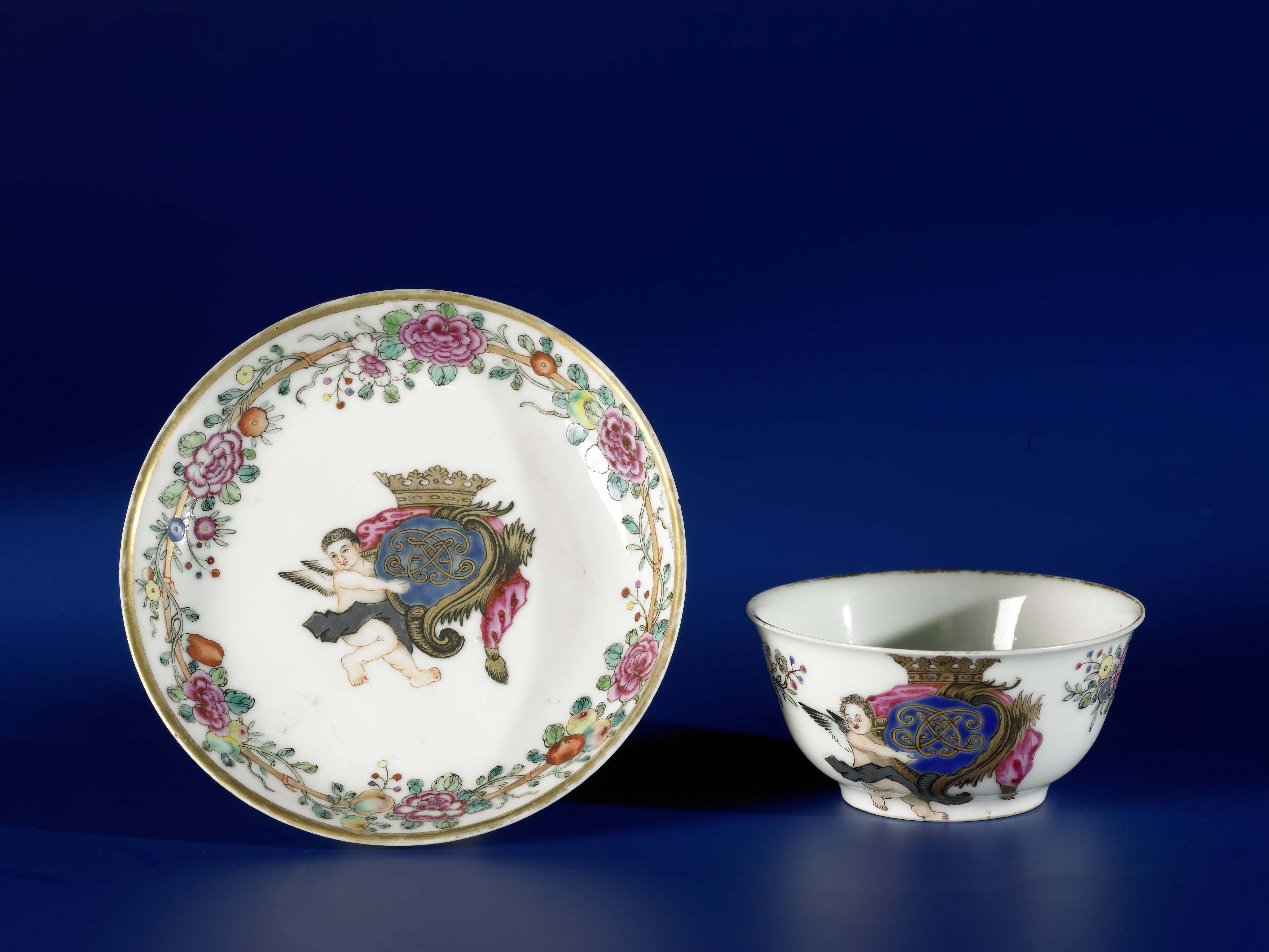 Bell-shaped cup with a crowned monogram with putto and a bamboo border with floral scrolls