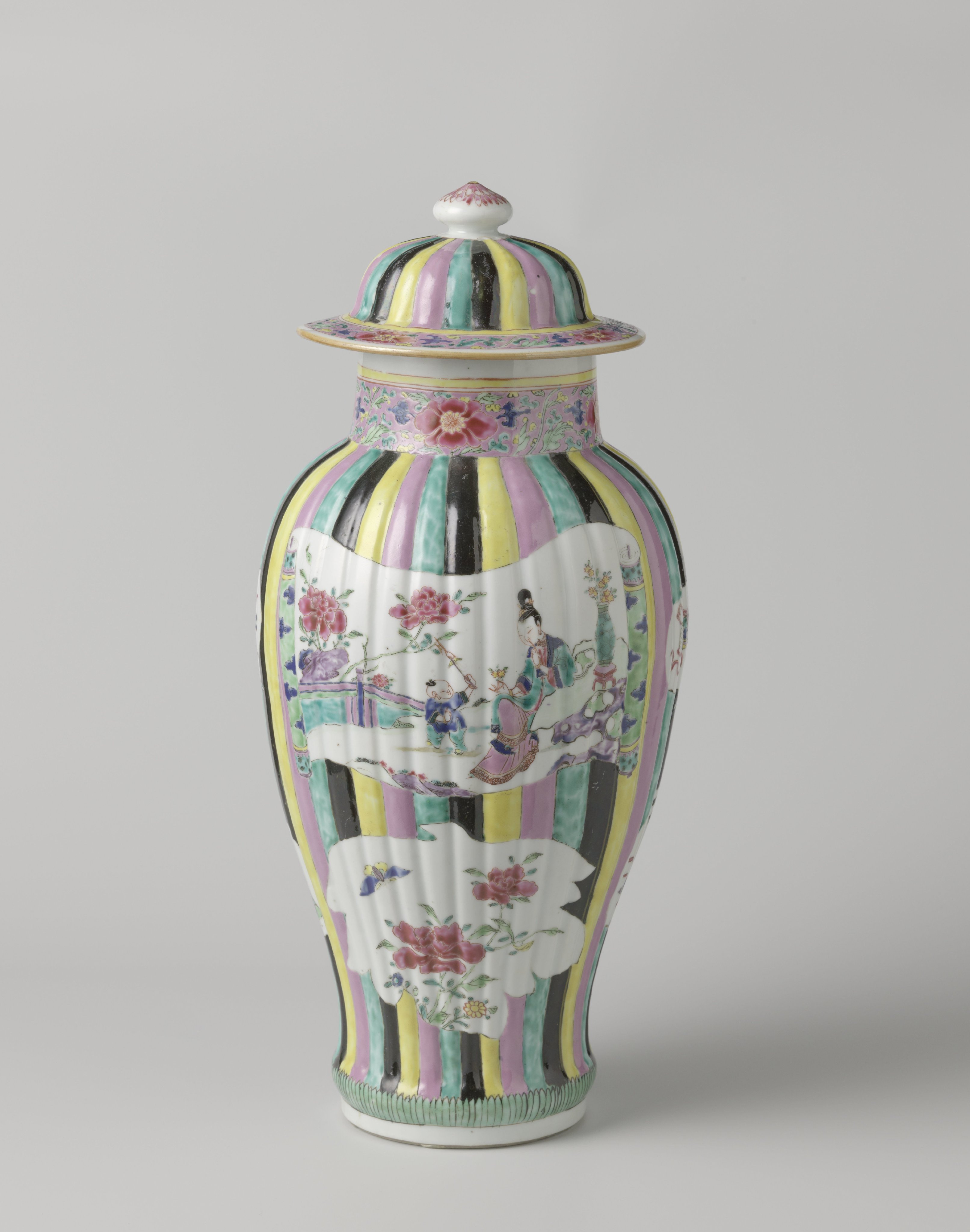 Covered jar with figures, flower sprays and auspicious symbols in shaped panels on a multi-colored ground