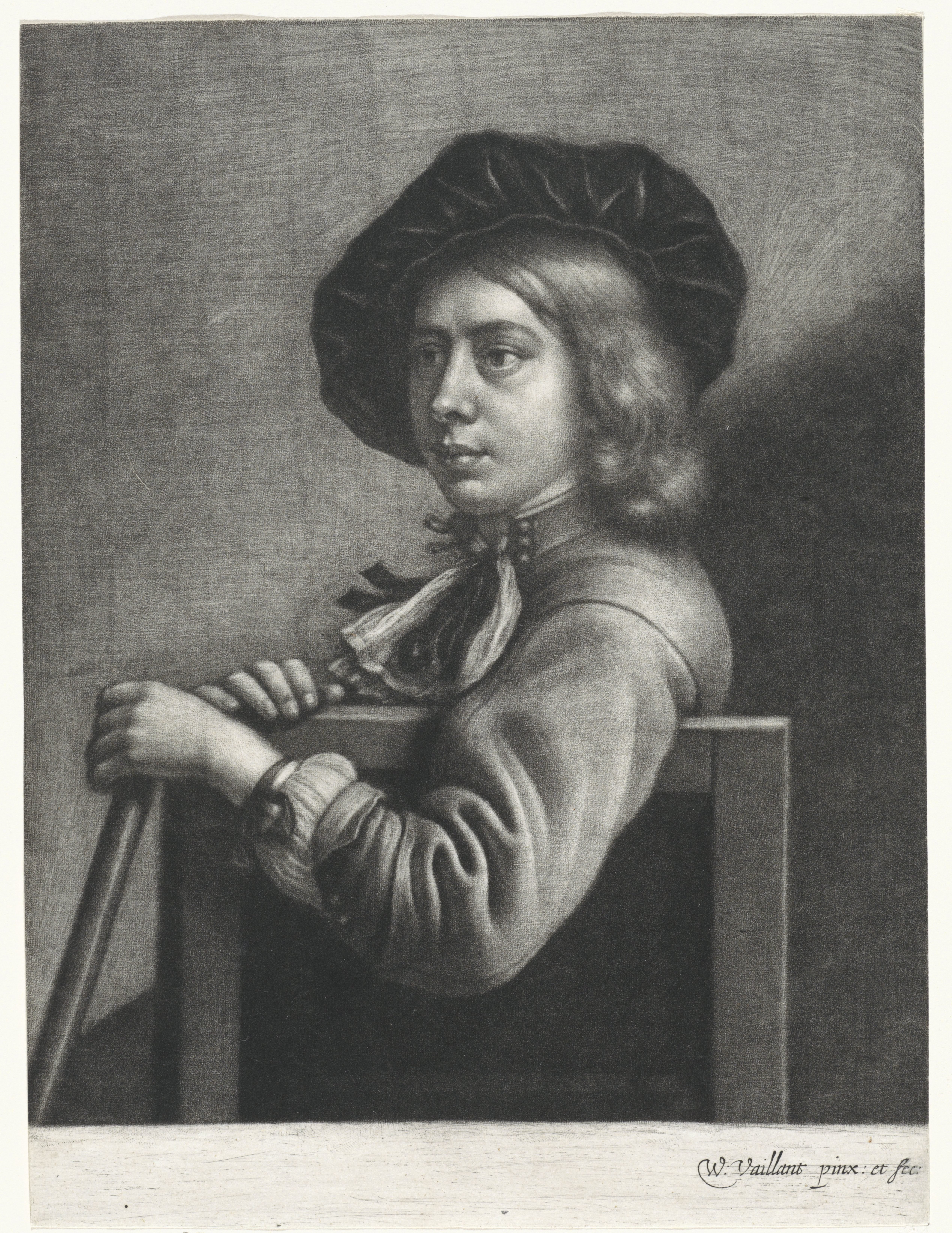 Zittende jongen met een baret