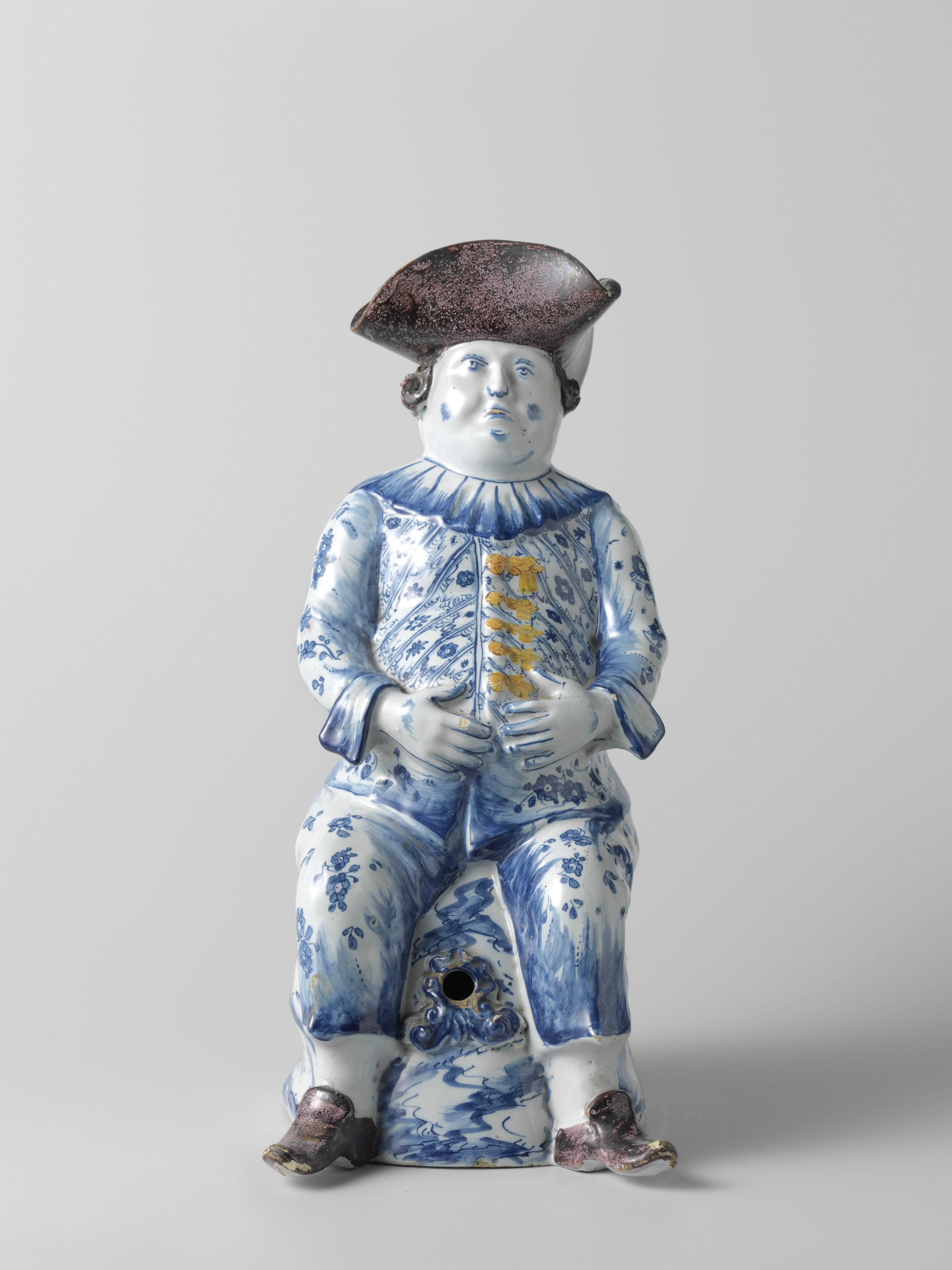 Jug in the form of a seated man