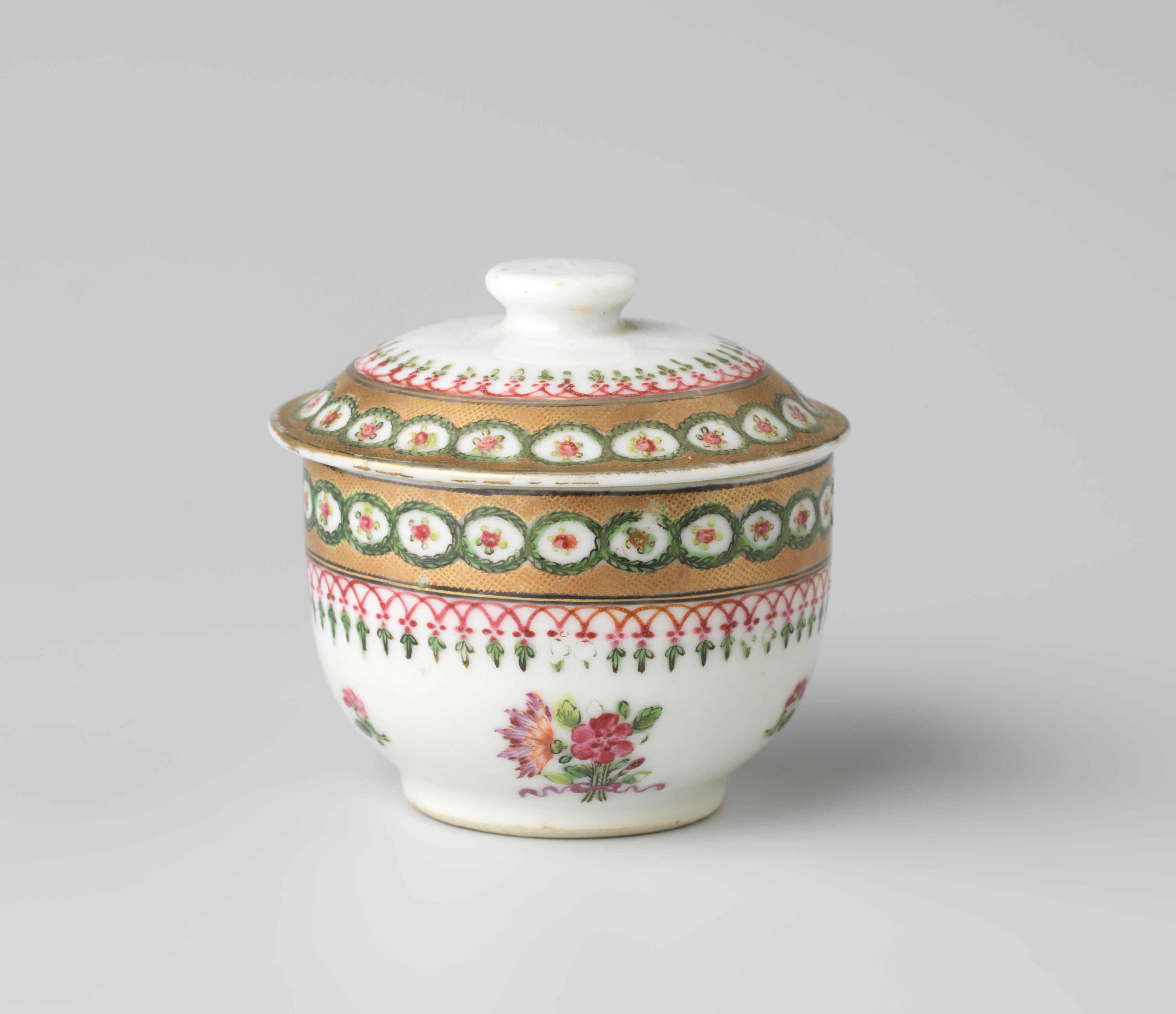 Covered jar with bouquets, scattered flowers and ornamental borders