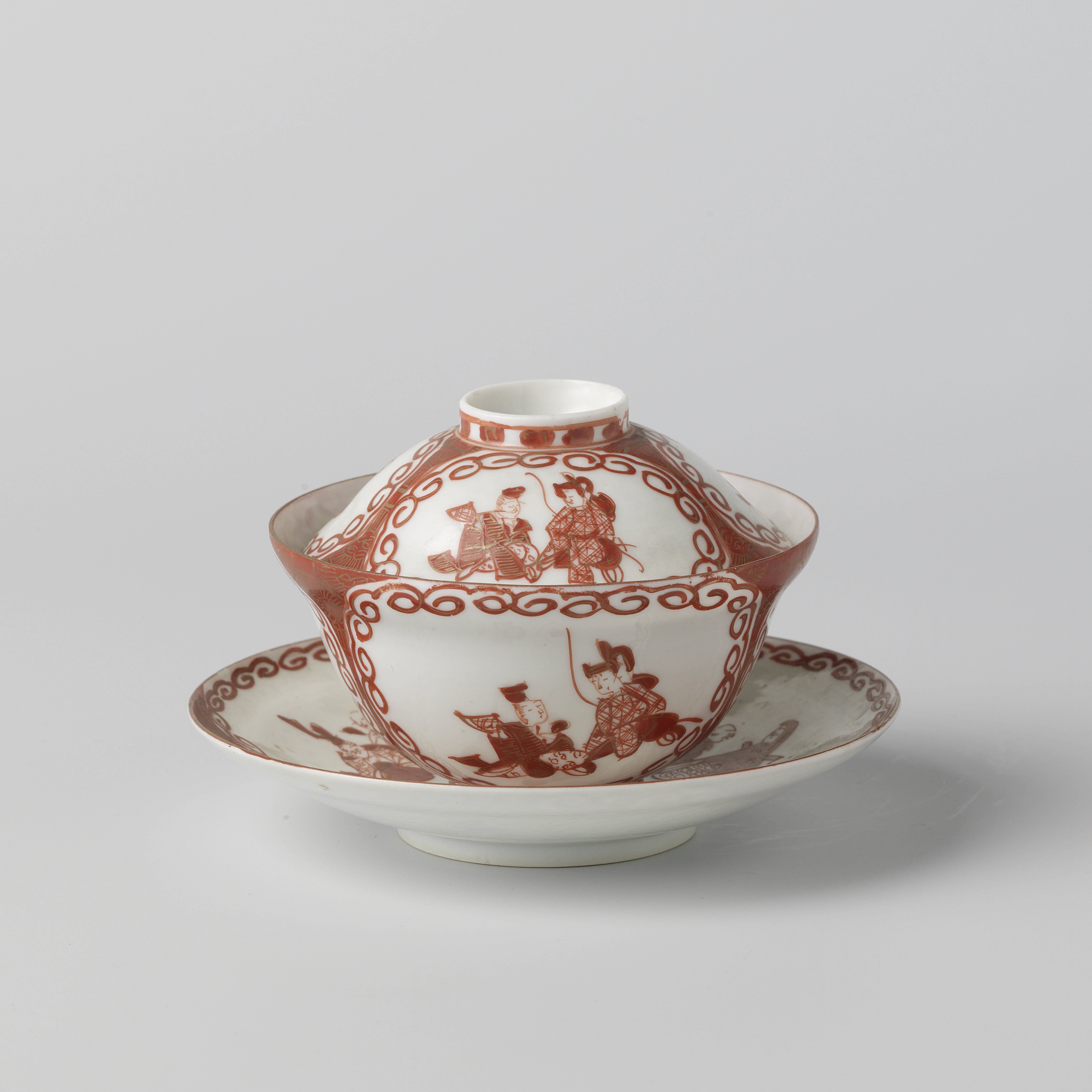 Covered cup and saucer with three panels with two seated figures