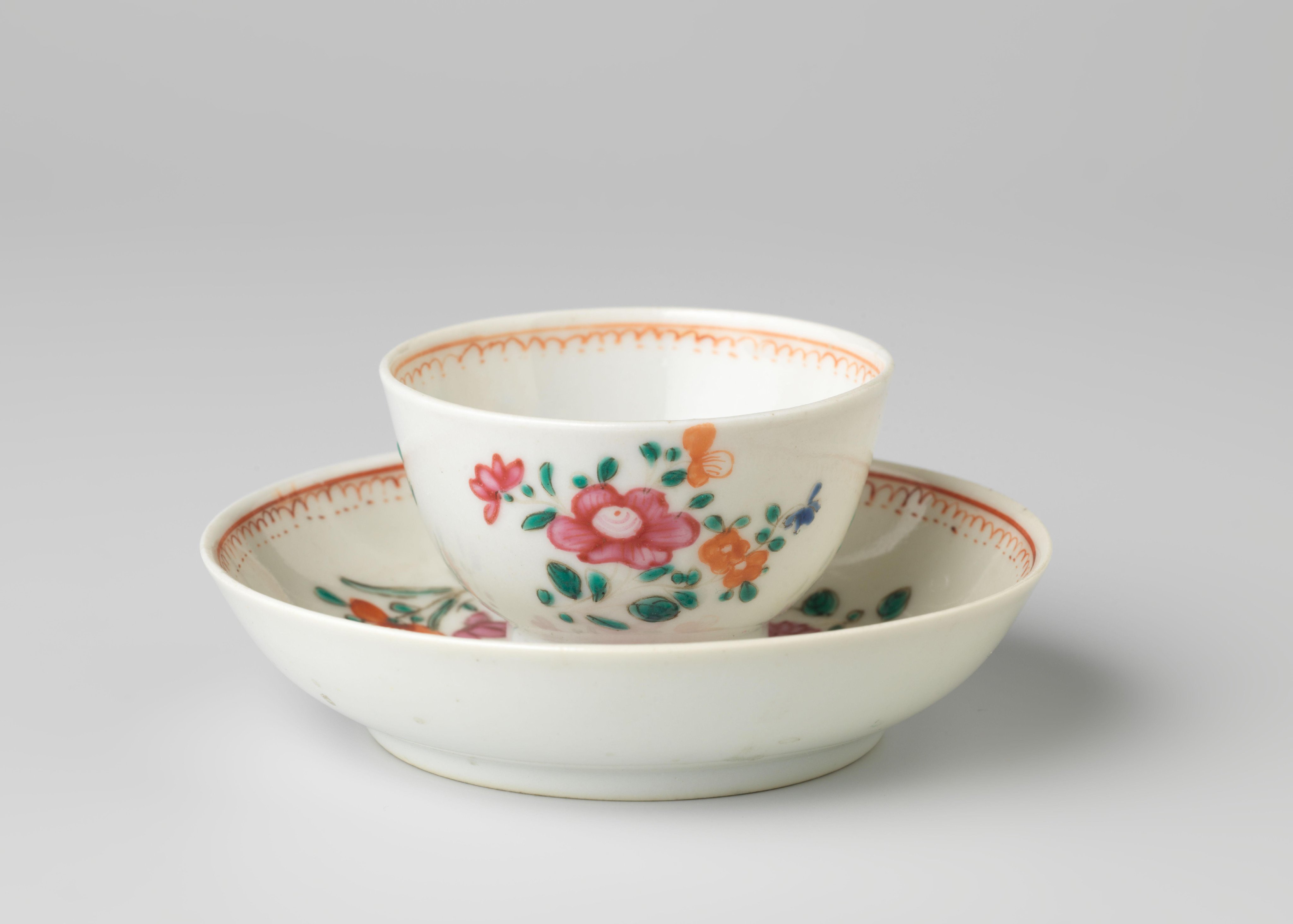 Straight-sided cup and saucer with three flower sprays