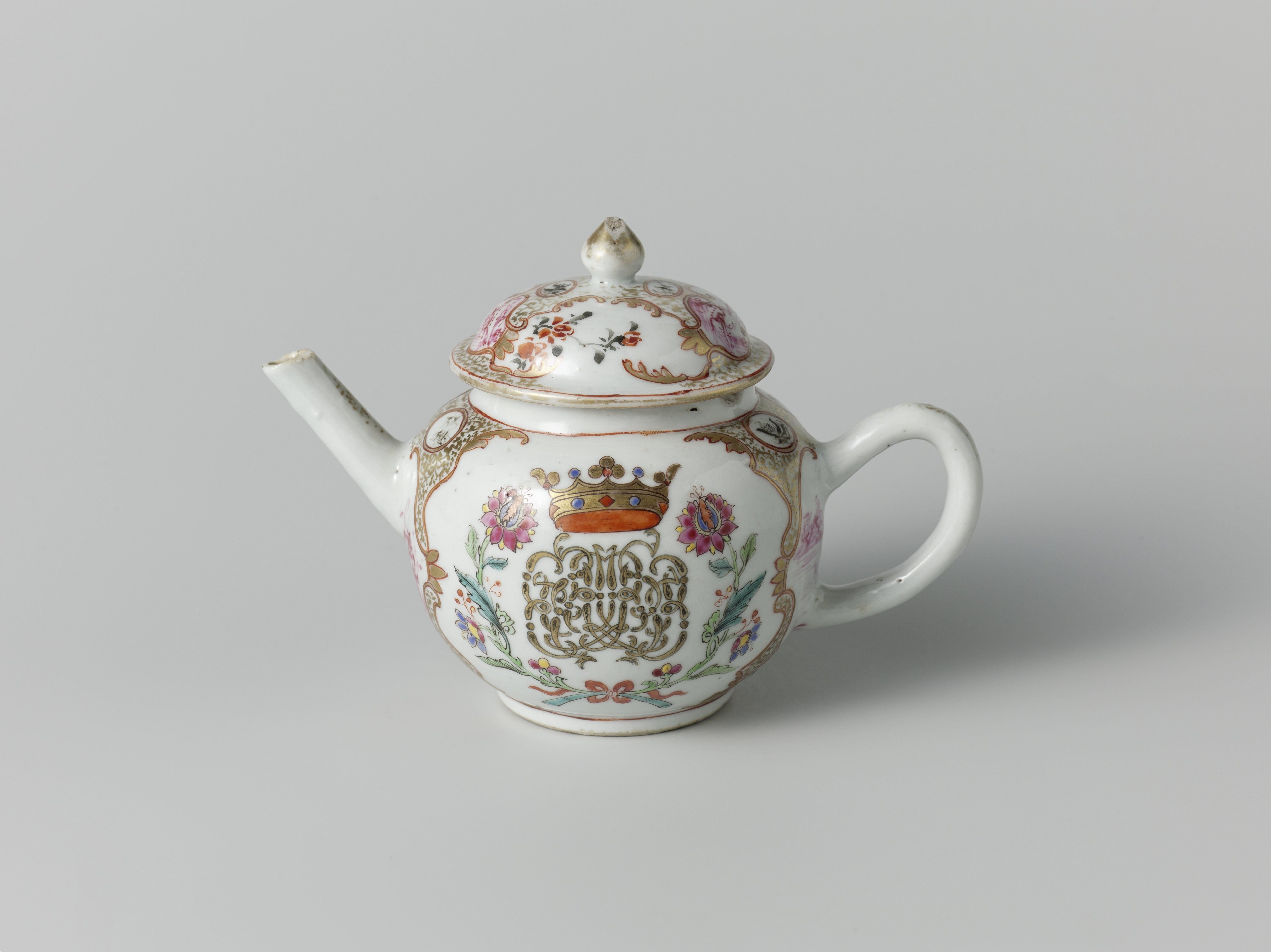 Teapot with a crowned, illegible monogram surrounded by two flower sprays