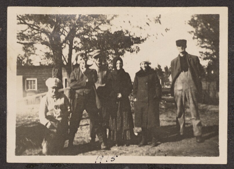 [Group portrait on a lawn]