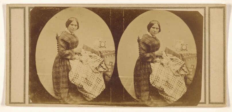 [Woman seated, sewing]