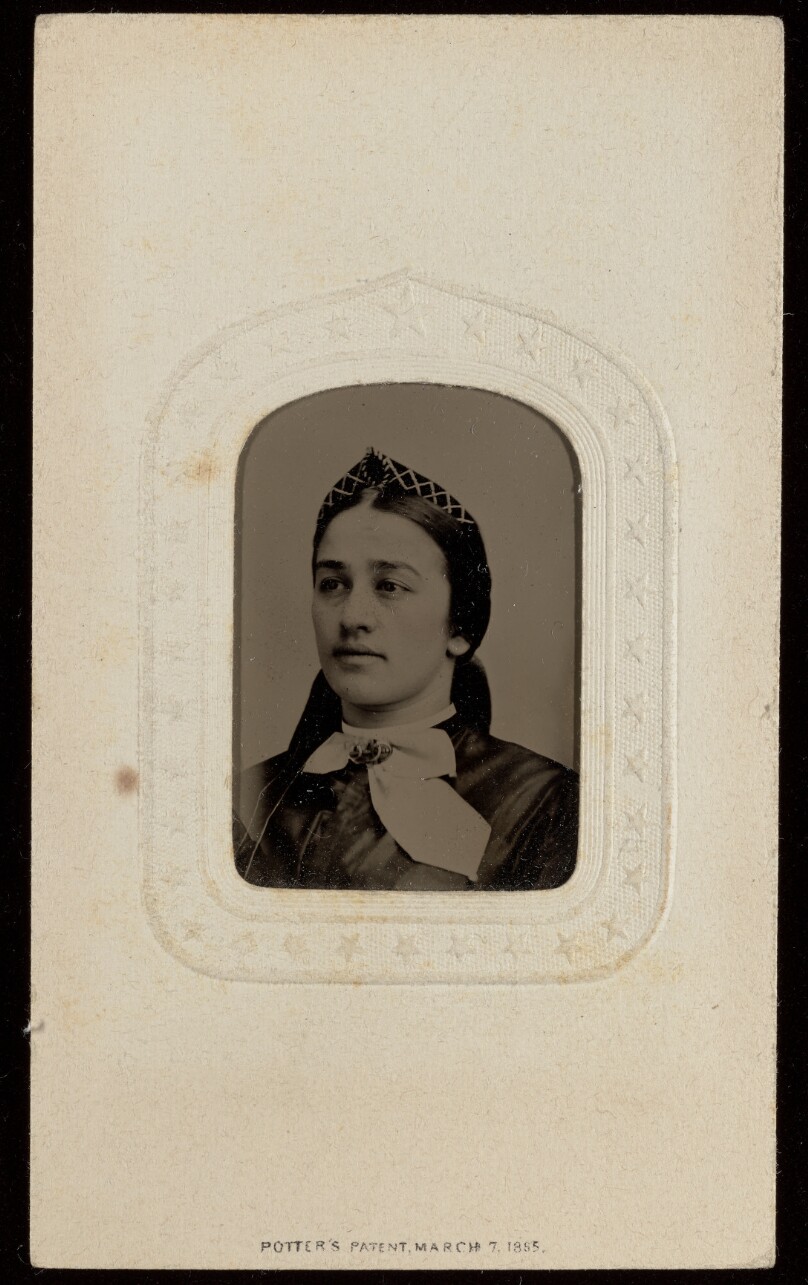 [Unidentified woman wearing a triangular pointed hat]