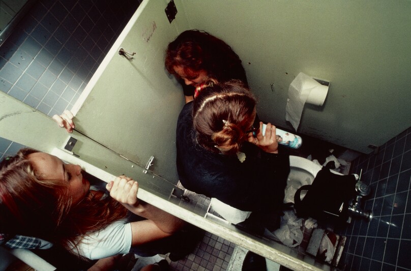 A freshman watches a sophomore inhale air freshener in the high school bathroom during nutrition break, Hollywood