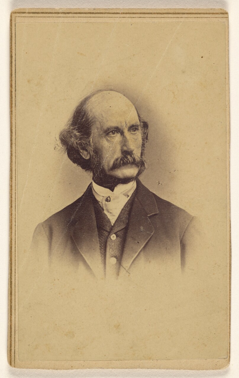 [Unidentified bald man with moustache, printed in vignette-style]