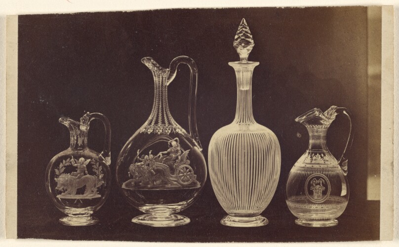 [Four ornate cut-crystal vases]