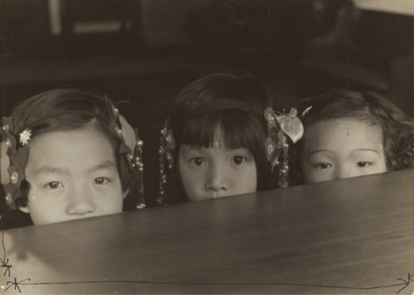 Little Girls Peeking Over Rim of Table at California Chinese Mission School. CA