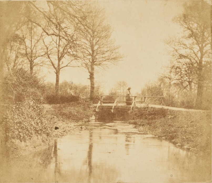 [Woman on bridge in countryside]