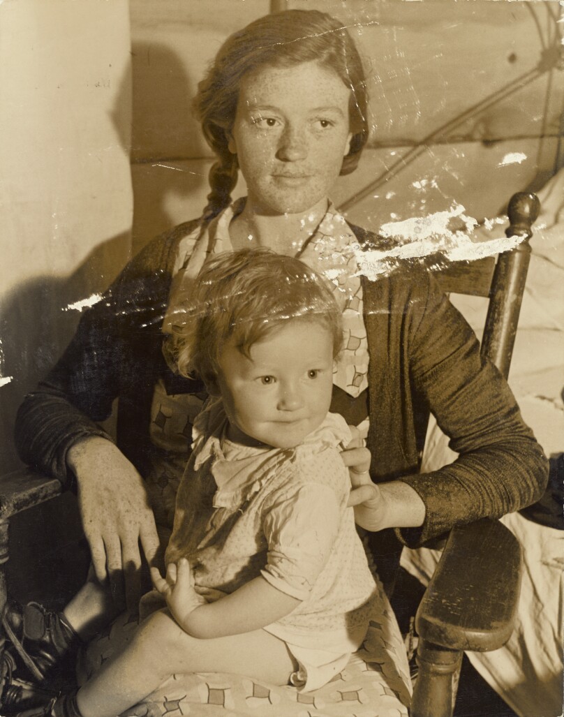 [Woman with child in rocking chair]