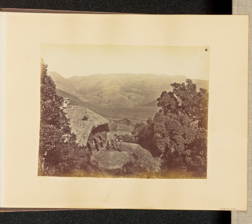 [Landscape View with Thatched Building]