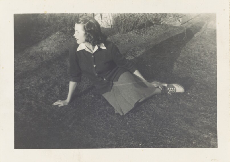 [Maggie sitting in the grass]