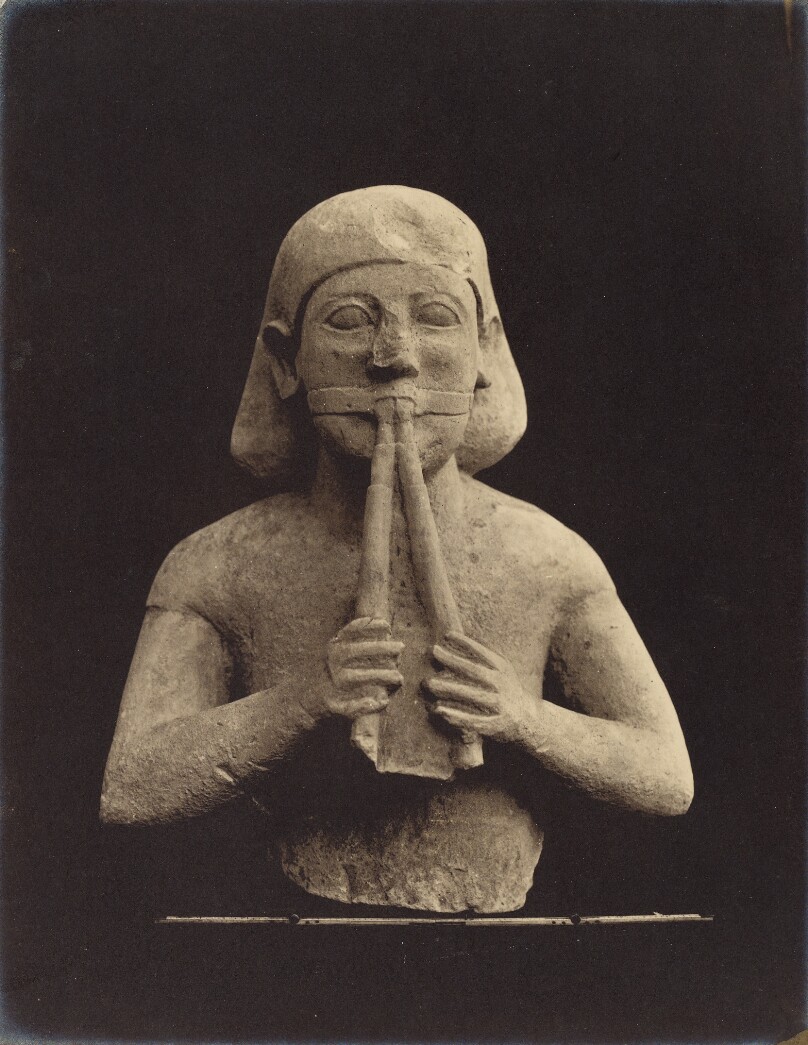 Figure of a Flute-player in the ministry of the Temple, also showing the influence of an Egyptian style