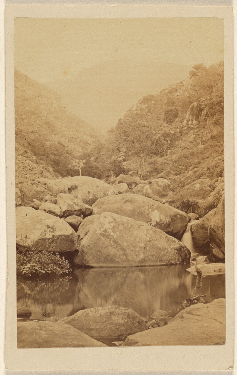 [View of an unidentified mountain area with rocks and stream]