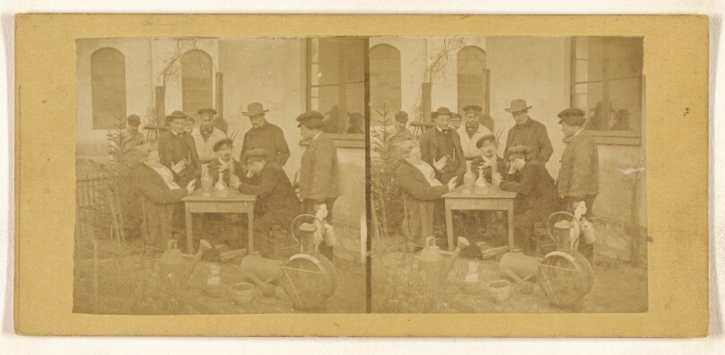 [Two men playing cards at a table, decanters on top, several men standing over them observing]