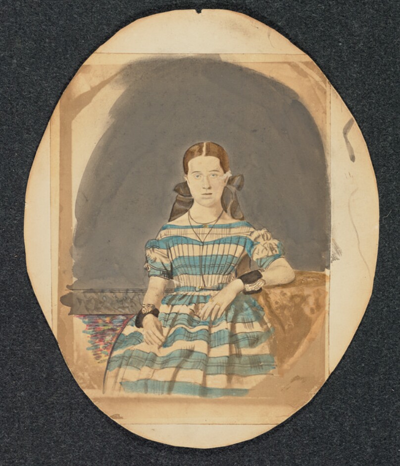 [Portrait of young woman in striped dress]