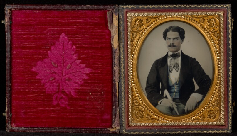 [Portrait of a Seated Man with a Mustache Holding a Cane] 