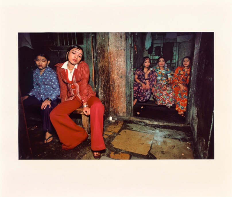 Seated Nepalese girls waiting for customers, Falkland Road, Bombay, India