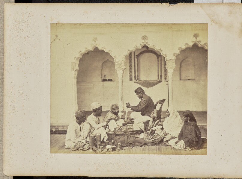 [Group portrait of four men and three women]