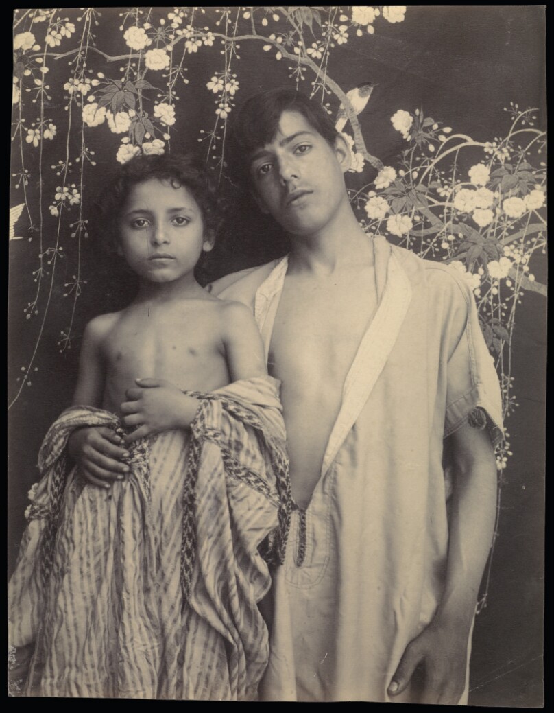 [Sicilian Boy and Girl Before Floral Textile]