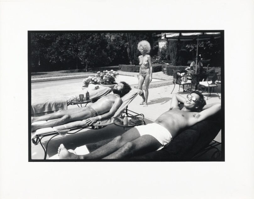 [Topless Woman and Men By Pool]