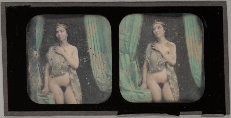 [Female Nude wearing a headpiece, seated]