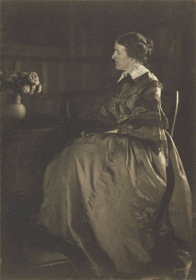 [Self-portrait with Table and Flowers]