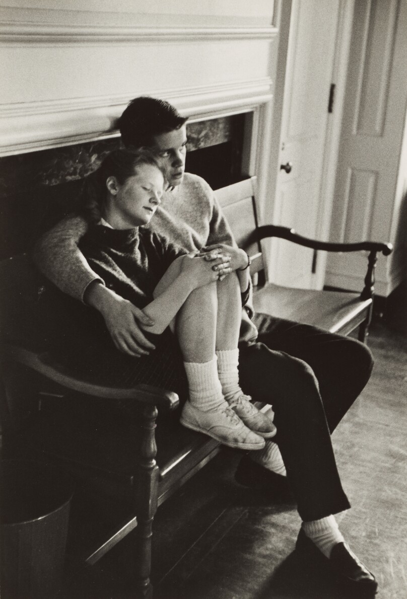 [Boy and Girl Sitting on a Bench Inside a Room]