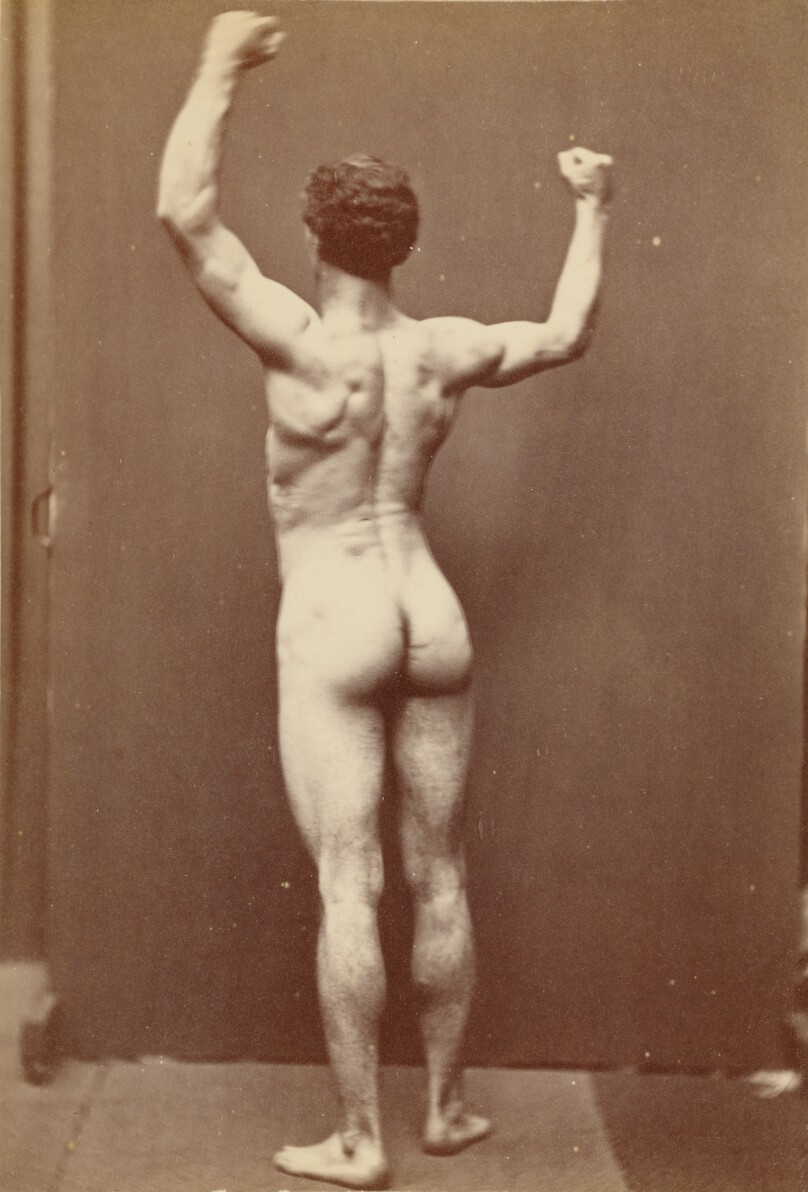 [Male nude with arms raised]