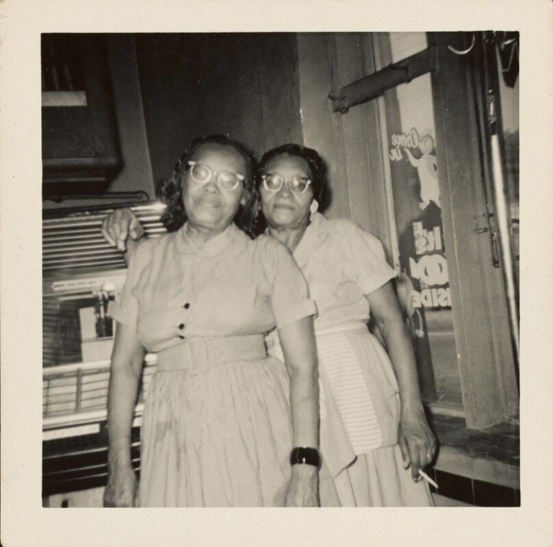 [Two women beside jukebox]
