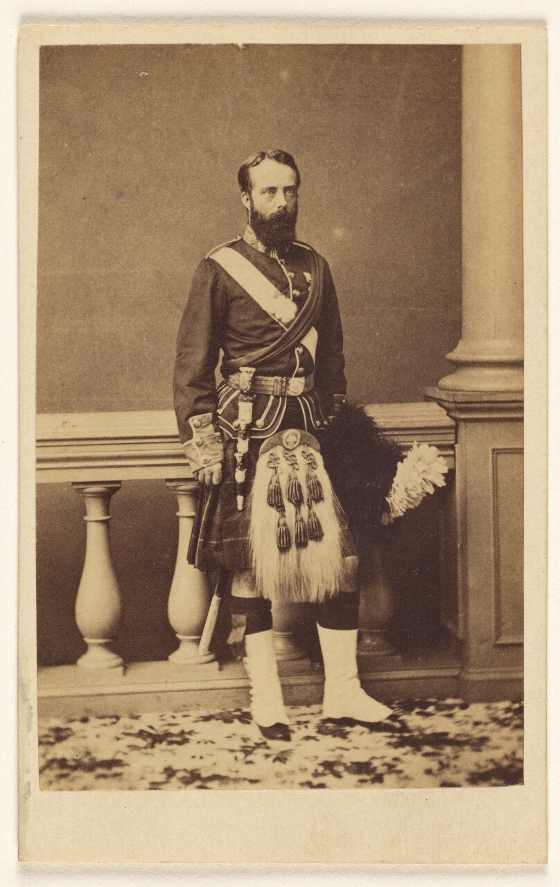[Unidentified bearded man in kilt, standing]