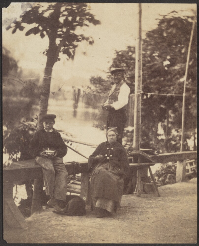 [Three People along a River Bank]