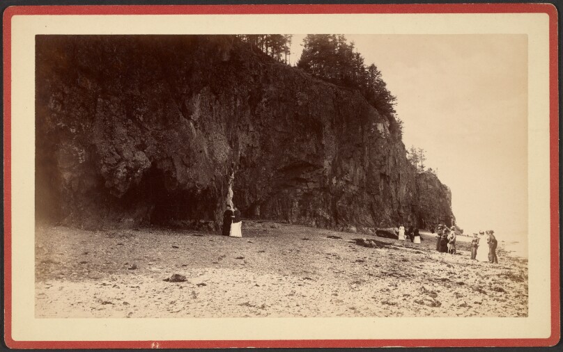 [Group of people on shoreline near cliffs, possibly at Mt. Desert, Maine]
