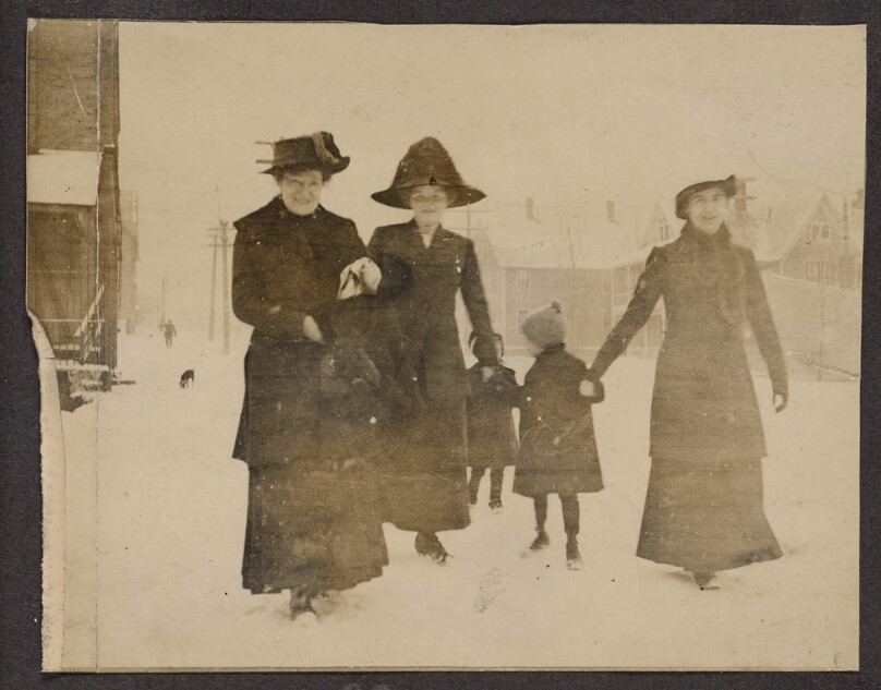 [Women and children walking in the snow]