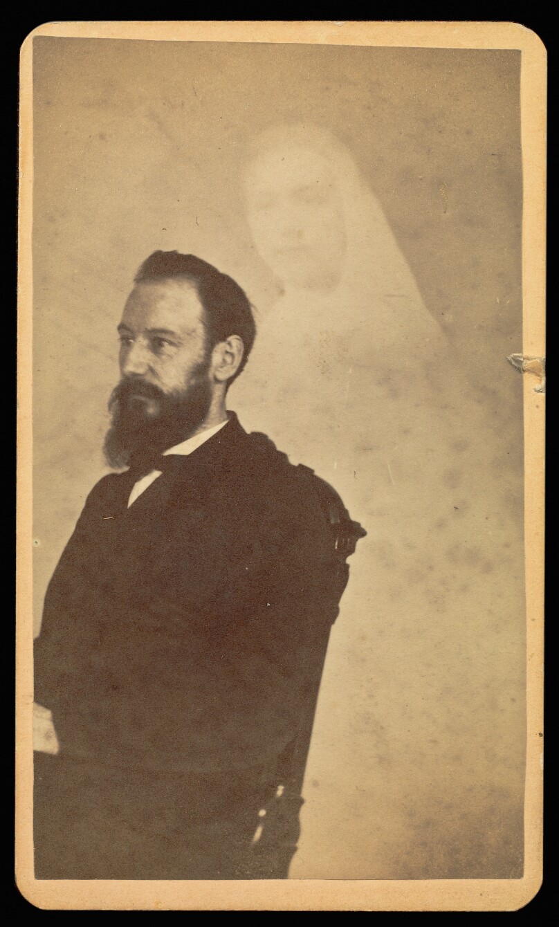 [Unidentified bearded man seated, a female "spirit" in the background]
