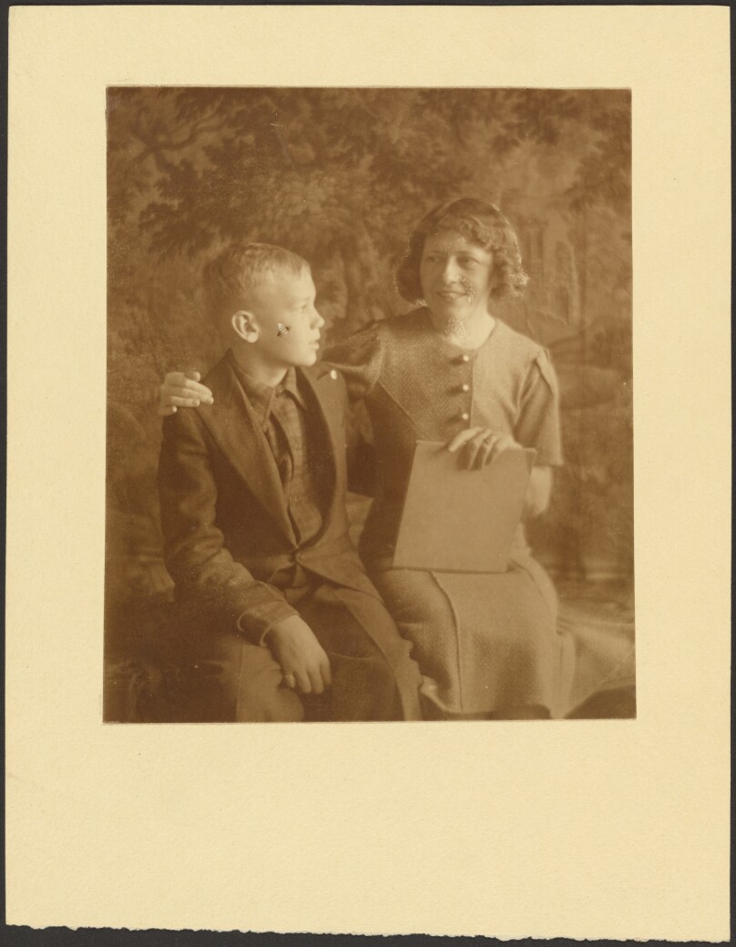 [Woman and Young Man Seated Before Tapestry]
