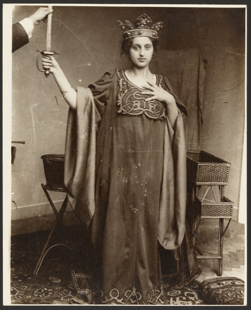 [Female Model Wearing Crown and Holding Sword]