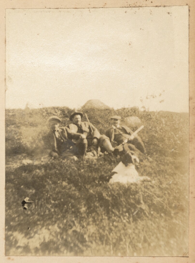 [Two men and dog]