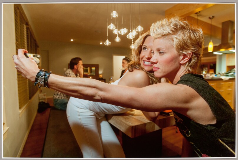 Personal trainer and reality-TV star Jackie Warner (right), 38, with Rebecca (left), 31, one of two women she is dating who have come to a Valentine’s Day dinner party at Warner’s home, Los Angeles, 2007