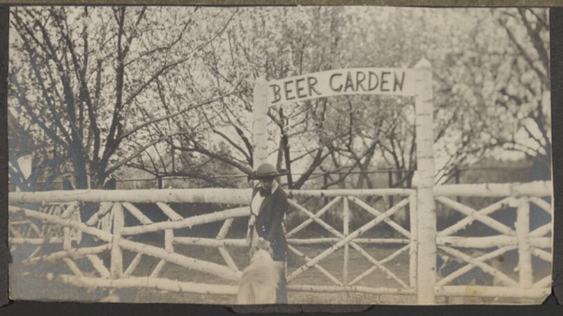 [Woman and dog at beer garden]