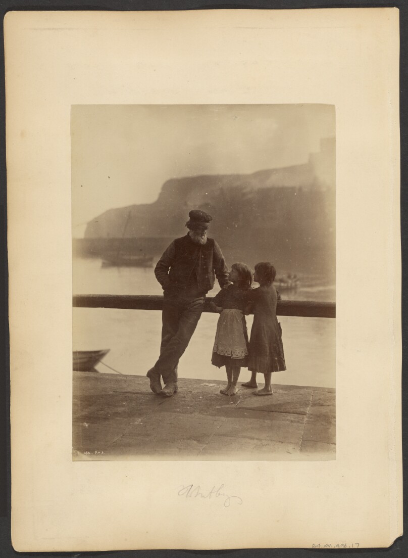 [Old man and two girls]