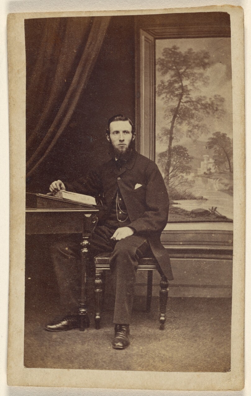 [Unidentified bearded man, seated]