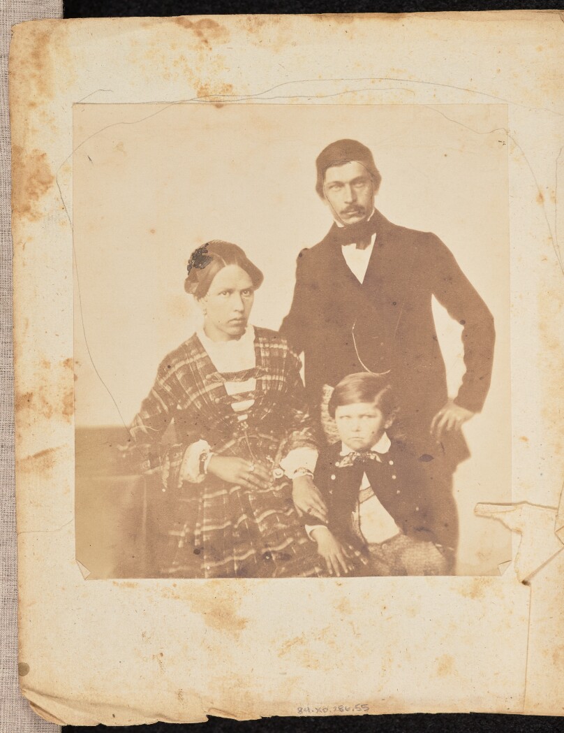 [Portrait of a man, woman, and child]