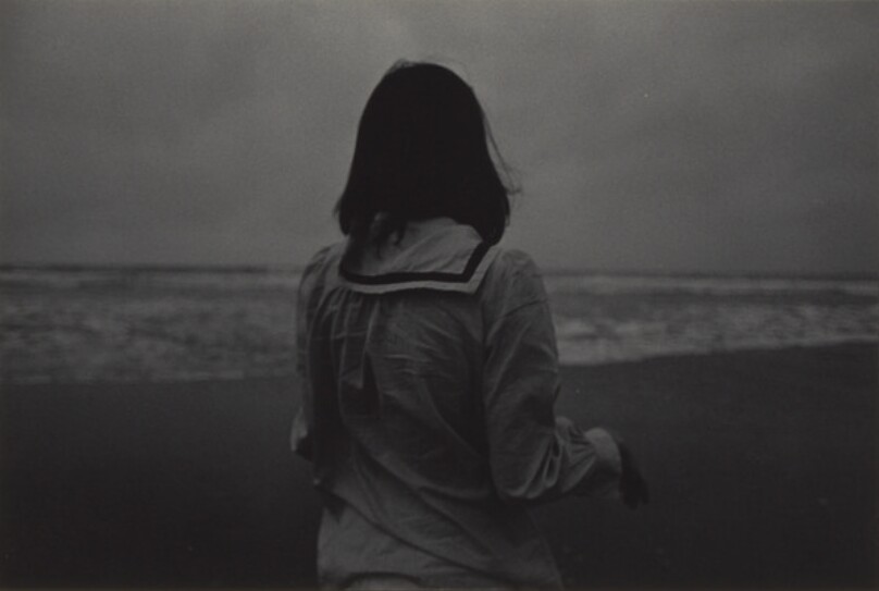 [Japanese Girl Standing at the Beach]
